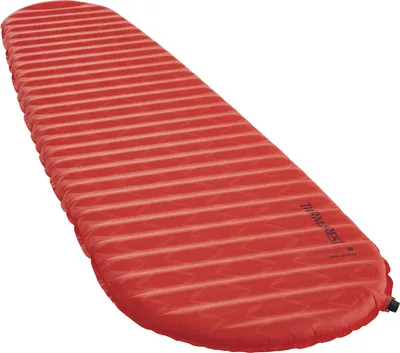 A red Therm-a-Rest Prolite Apex sleeping pad is shown on a white background.