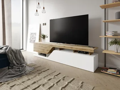A modern living room with a TV stand and television.