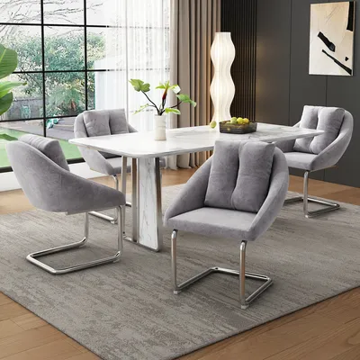 A dining room set with a marble-top table and four gray upholstered chairs.