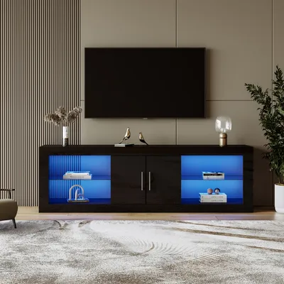 A modern living room with a TV stand and a television.