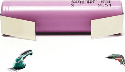 A battery pack is shown with two small tools below it.