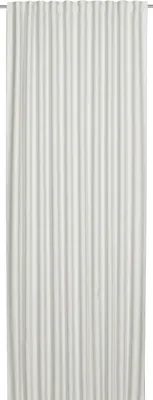 A full-length white curtain hanging vertically.