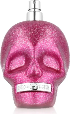 A pink glittery skull-shaped perfume bottle with a silver cap and a silver band with the word "POLICE" on the front.