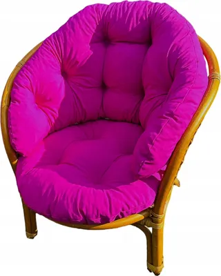 A close-up studio shot of a fuchsia cushion on a rattan chair.