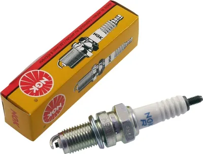 A spark plug and its packaging are shown against a white background.