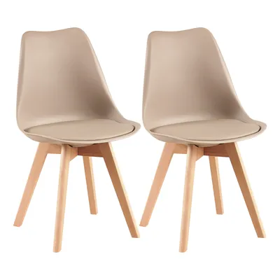 Two beige dining chairs with wooden legs are shown against a white background.