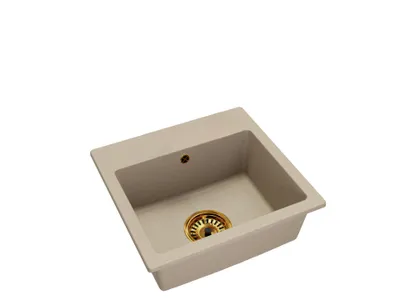 A single beige sink with a golden drain.