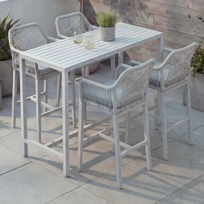 Immagine prodotto di Set tavolo da bar + 4 sgabelli da bar HWC-P91, sedia da bar tavolo alto, imbottitura per seduta da esterno in metallo intrecciato ~ grigio chiaro