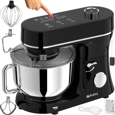 A black and silver stand mixer with various attachments is shown from a slightly elevated front-left angle against a white background. A hand is shown pressing a button on the mixer's digital display.