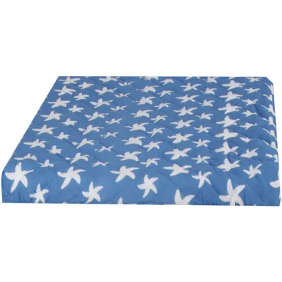 A blue quilted cover with white star patterns, shown from a side angle.