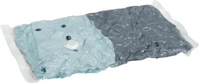 A vacuum-sealed storage bag filled with clothing.