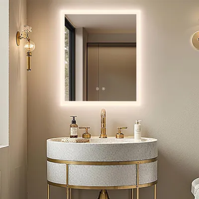 A bathroom vanity with a mirror and sink.