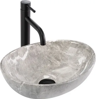 A grey oval marble sink with a black faucet against a white background.