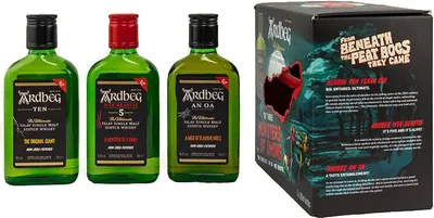 Three small bottles of Ardbeg whisky and a branded box.