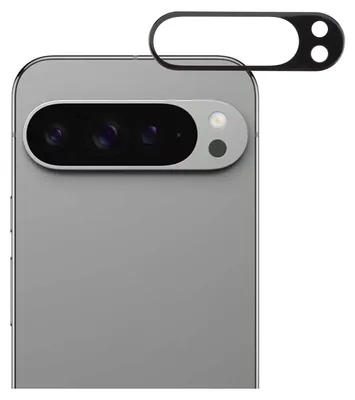 A close-up of the rear camera module of a smartphone, with a protective lens cover placed above it.
