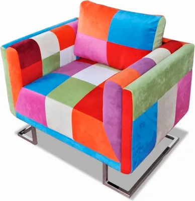 A colorful patchwork armchair with chrome legs on a white background.