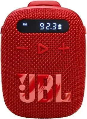 A red JBL portable speaker with a digital display showing 'FM 92.3'.