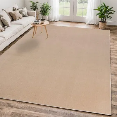 Image de Tapis Uni "Relax Samba" de la marque Unyqoos®, beige, en polyester, à poils ras, rectangulaire, dimensions 240 x 340 cm, poids 1250 g/m², lavable à 30°C, OEKO-TEX Standard 100