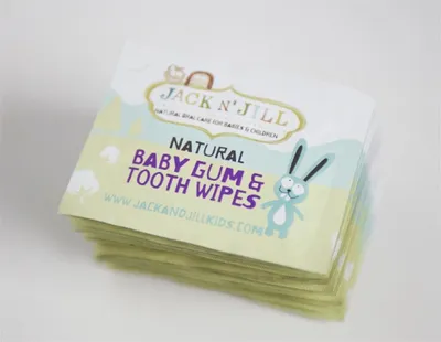 A stack of Jack N' Jill Baby Gum & Tooth Wipes packaging.