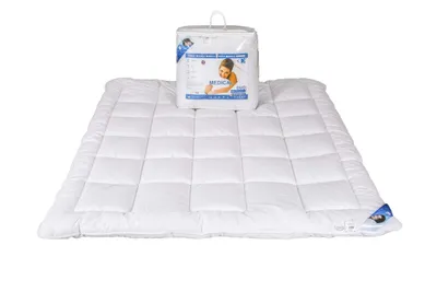 A white duvet and its packaging are displayed on a white background.