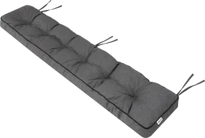 A dark gray bench cushion with black piping and tufting, shown diagonally against a white background.