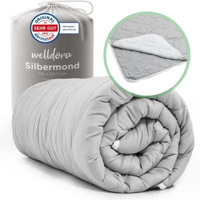 A rolled-up duvet is displayed next to its packaging and a close-up of the duvet's texture.