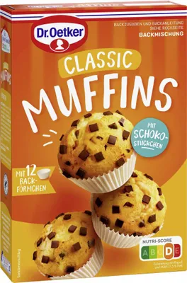 A box of Dr. Oetker Classic Muffins with chocolate chips, showing three finished muffins.