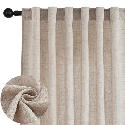 A close-up view of beige linen-look curtains hanging from a curtain rod.