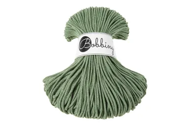 A spool of green macrame cord with a label.