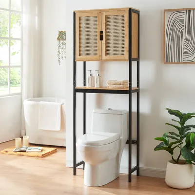 A bathroom scene featuring a toilet with an over-the-toilet storage unit.