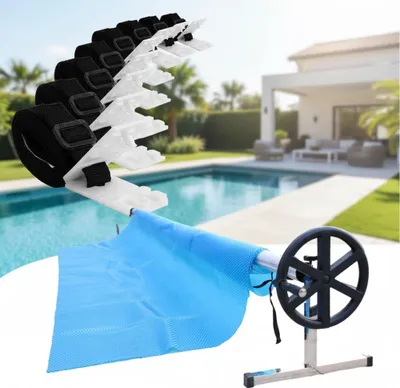 A pool cover roller and cover are shown in a backyard setting with a swimming pool and house.
