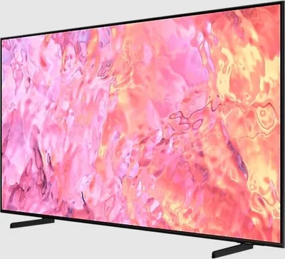 A modern flat-screen television with a black frame and stand, displaying a colorful abstract image on its screen.
