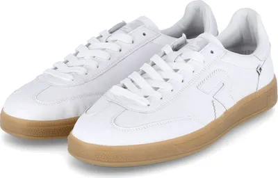 A pair of white athletic shoes with brown soles.