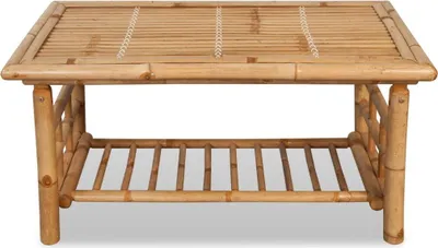 A front view of a bamboo coffee table with a lower shelf.