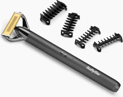 A gray electric razor with gold foil and several black comb attachments are laid out on a white background.