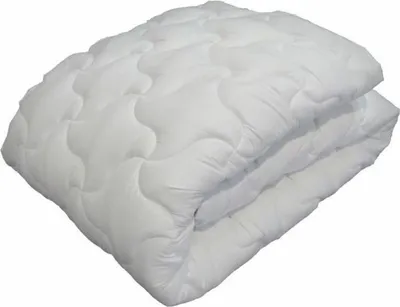 A folded white duvet on a white background.