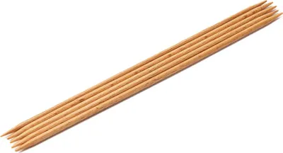 A set of wooden knitting needles arranged diagonally on a white background.