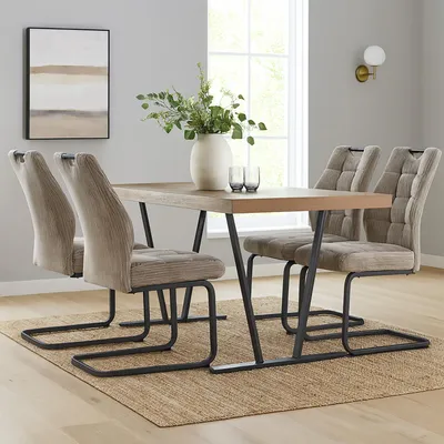 A dining room setting with a table and chairs.