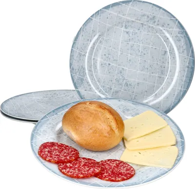 A set of plates with food items on one of them.