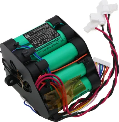 A close-up shot of a battery pack with green cylindrical cells and black plastic housing.