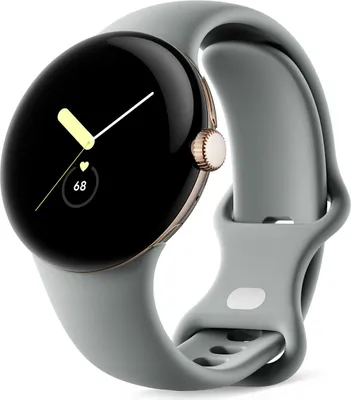 A Google Pixel Watch with a champagne gold casing and a hazel band is shown against a white background.