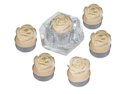 A set of six rose-shaped tea lights with gold glitter accents, one of which is placed in a hexagonal glass holder.