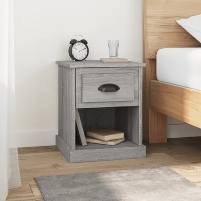 A bedside table next to a bed.