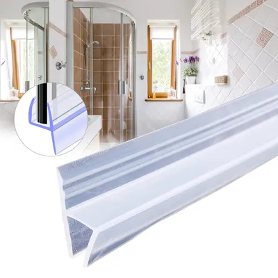 A close-up of a shower door seal in the foreground, with a blurred background of a modern bathroom and shower.