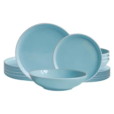 A set of light blue ceramic plates and bowls stacked and arranged.