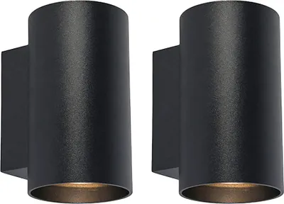 Two black cylindrical wall lights mounted on a white background.