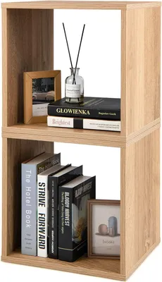 A two-tier cube shelf unit with books and decorative items.