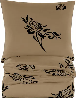 A folded duvet and pillow set with a black rose pattern on a beige background.