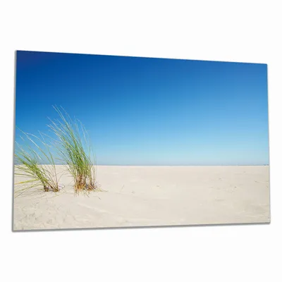 Produktbild von Wallario Herdabdeckplatte aus Glas, Größe 90 x 52 cm 1-teilig, Motiv Sandstrand unter blauem Himmel