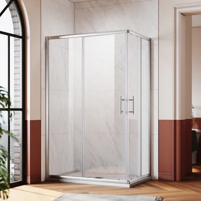 A modern bathroom with a glass shower enclosure.